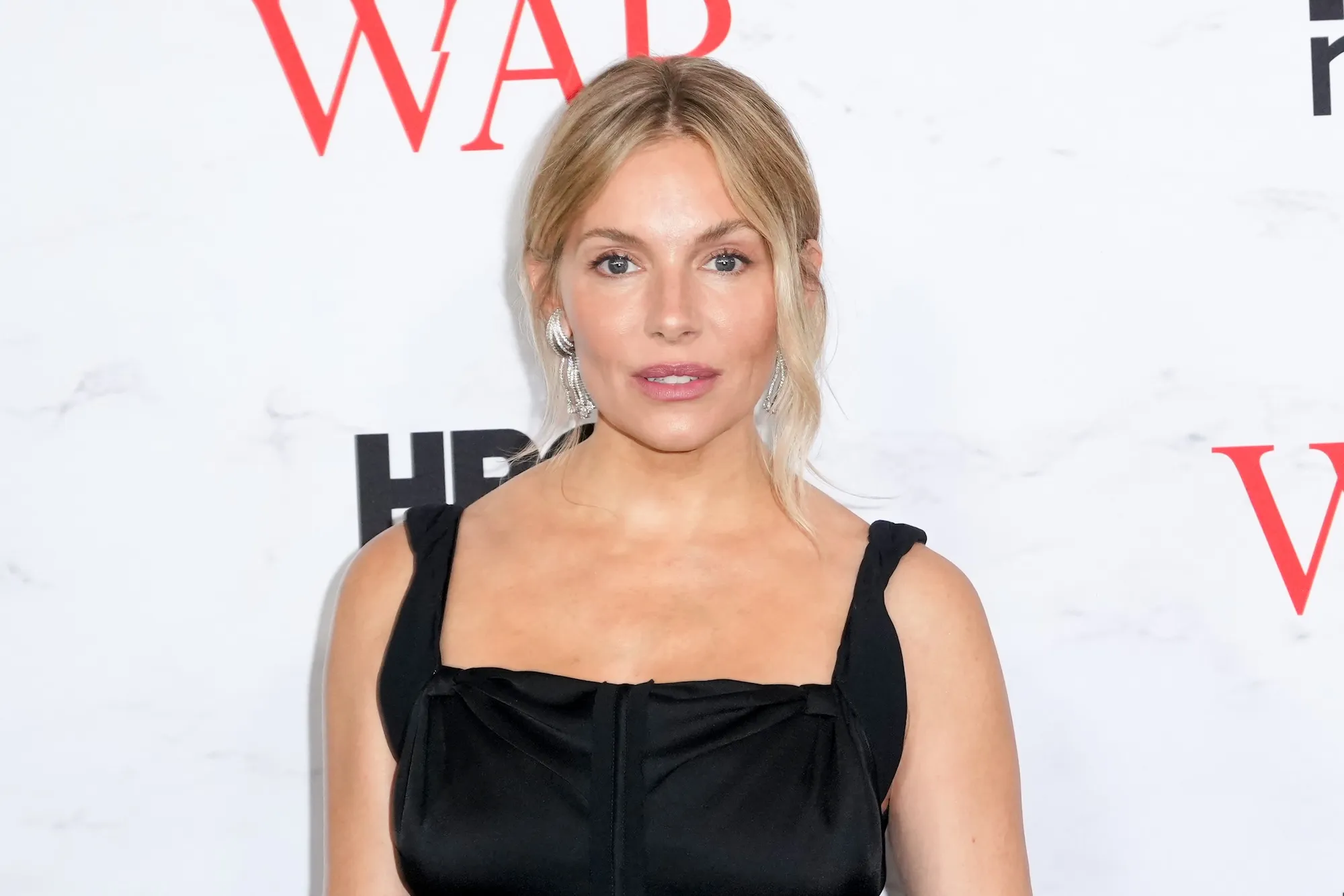 Sienna Miller Gives the Little Black Dress a Showgirl Makeover at ‘War’ New York Premiere