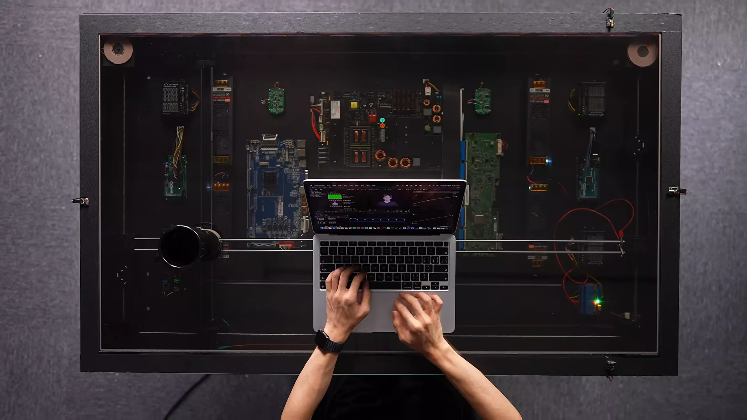 This amazing DIY desk uses a camera and a motor to charge your phone wherever you set it down
