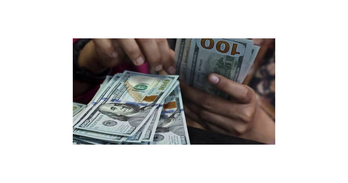 Dollar holds losses as markets await Fed minutes, speakers