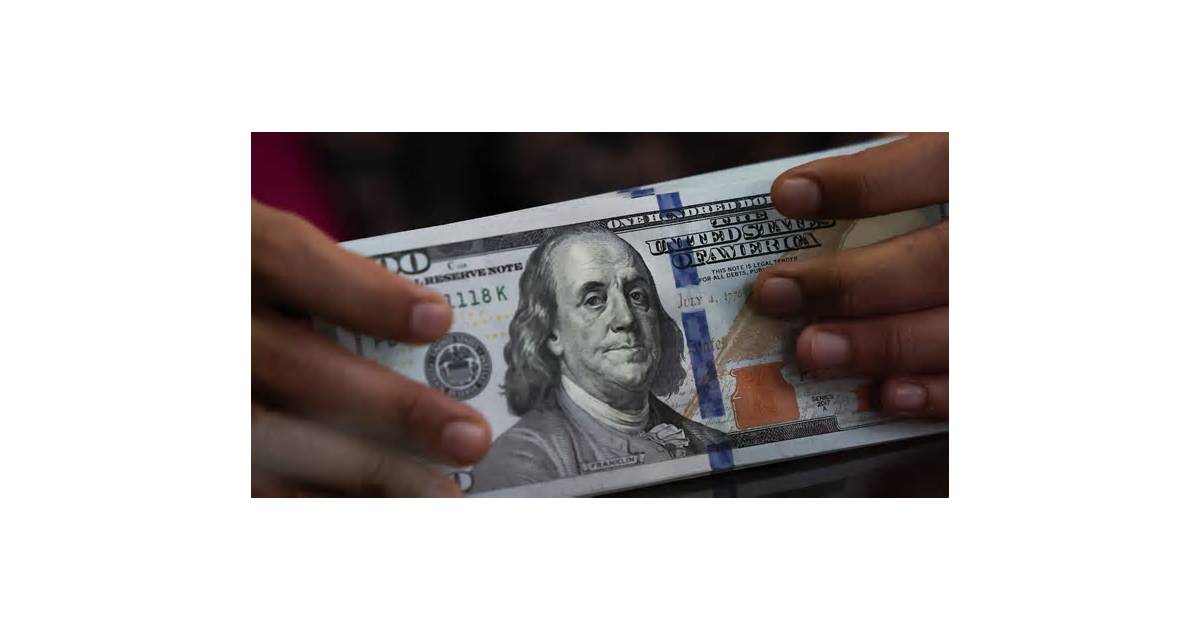 Dollar edges back from 18-month high after FOMC minutes