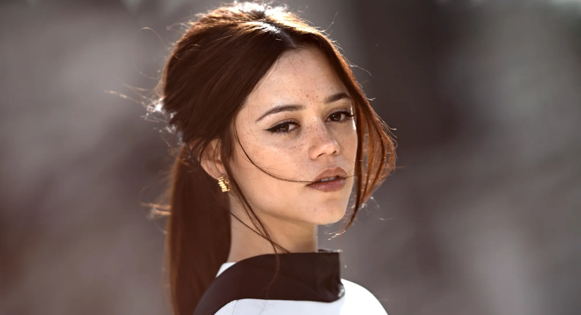 Jenna Ortega Puts Her Spin on the Little Silk Scarf Trend With Her Dog by Her Side