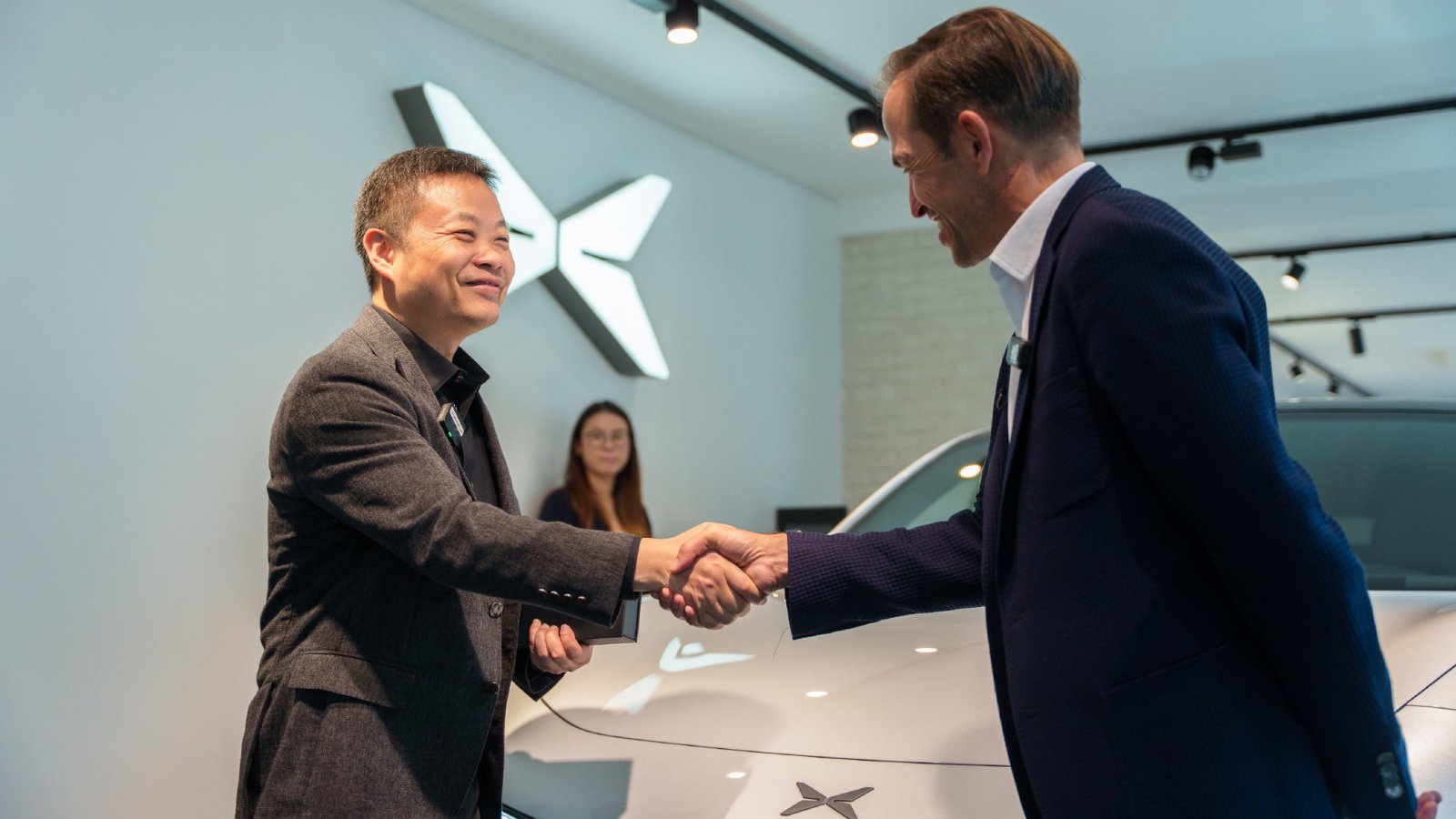 Xpeng starts Mona L03 deliveries in Europe, with CEO handing over first car in France