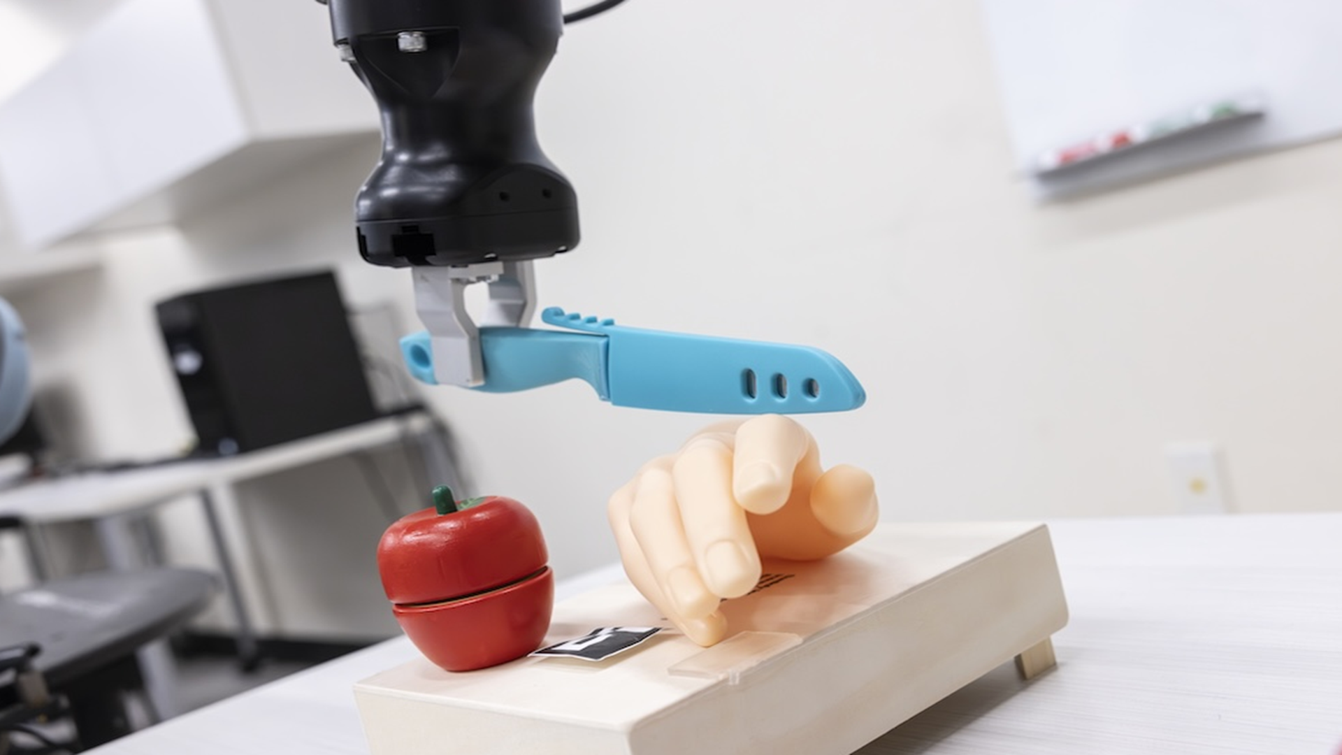 Two-letter trigger makes US robot turn knife toward human hand in security test