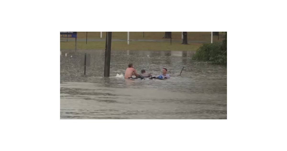 Australian TV reporter rescues man from sinking car during floods