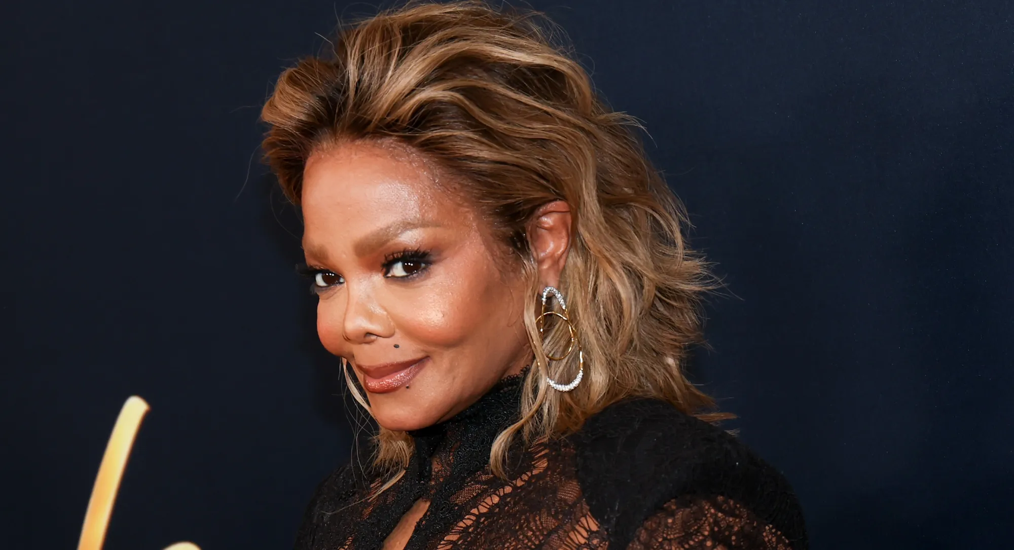 Janet Jackson Elevates the Dark Glamour Trend in Christian Siriano