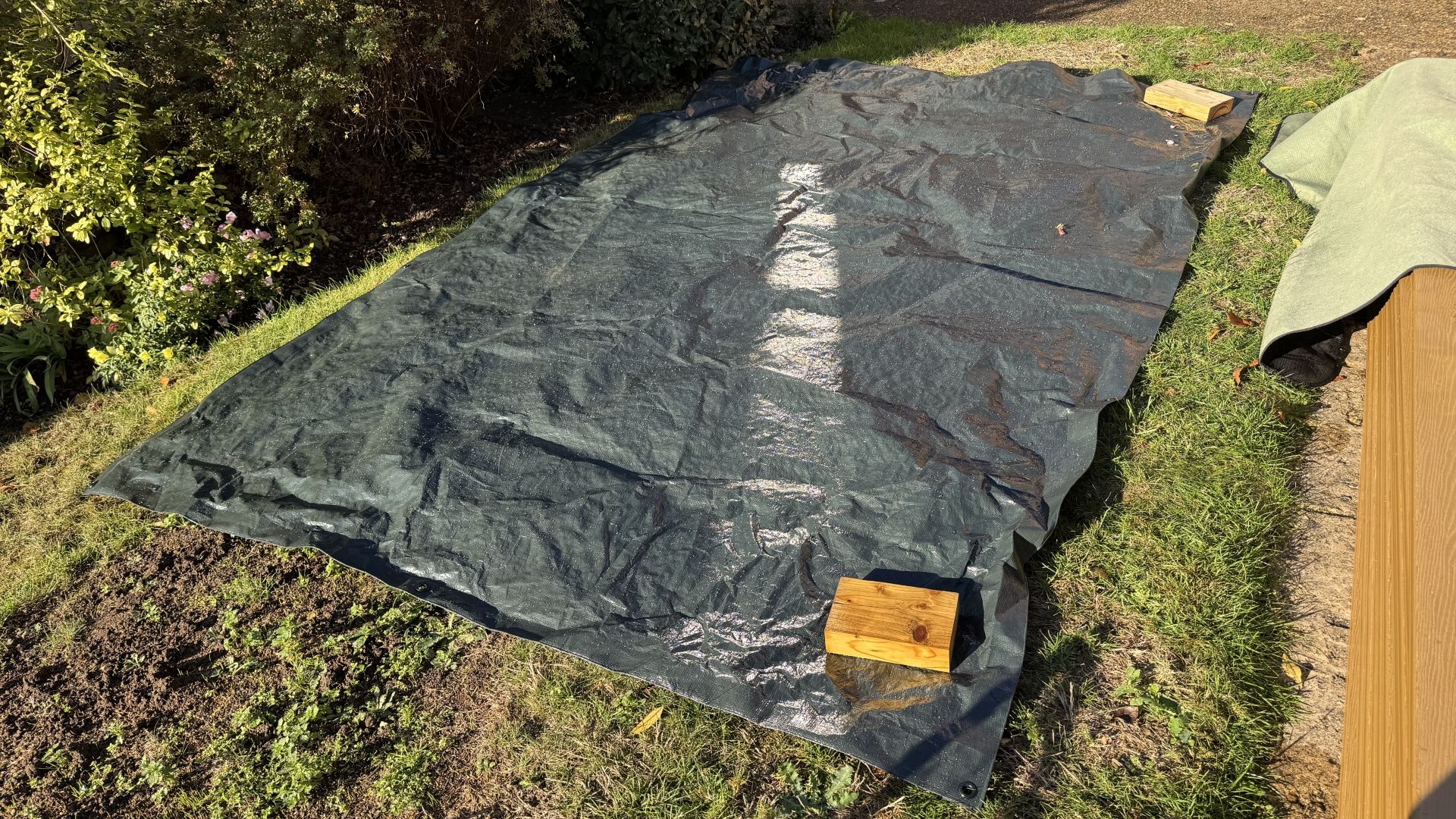 I tried the 'tarp burrito' method to clear leaves from my yard — and it's a game changer