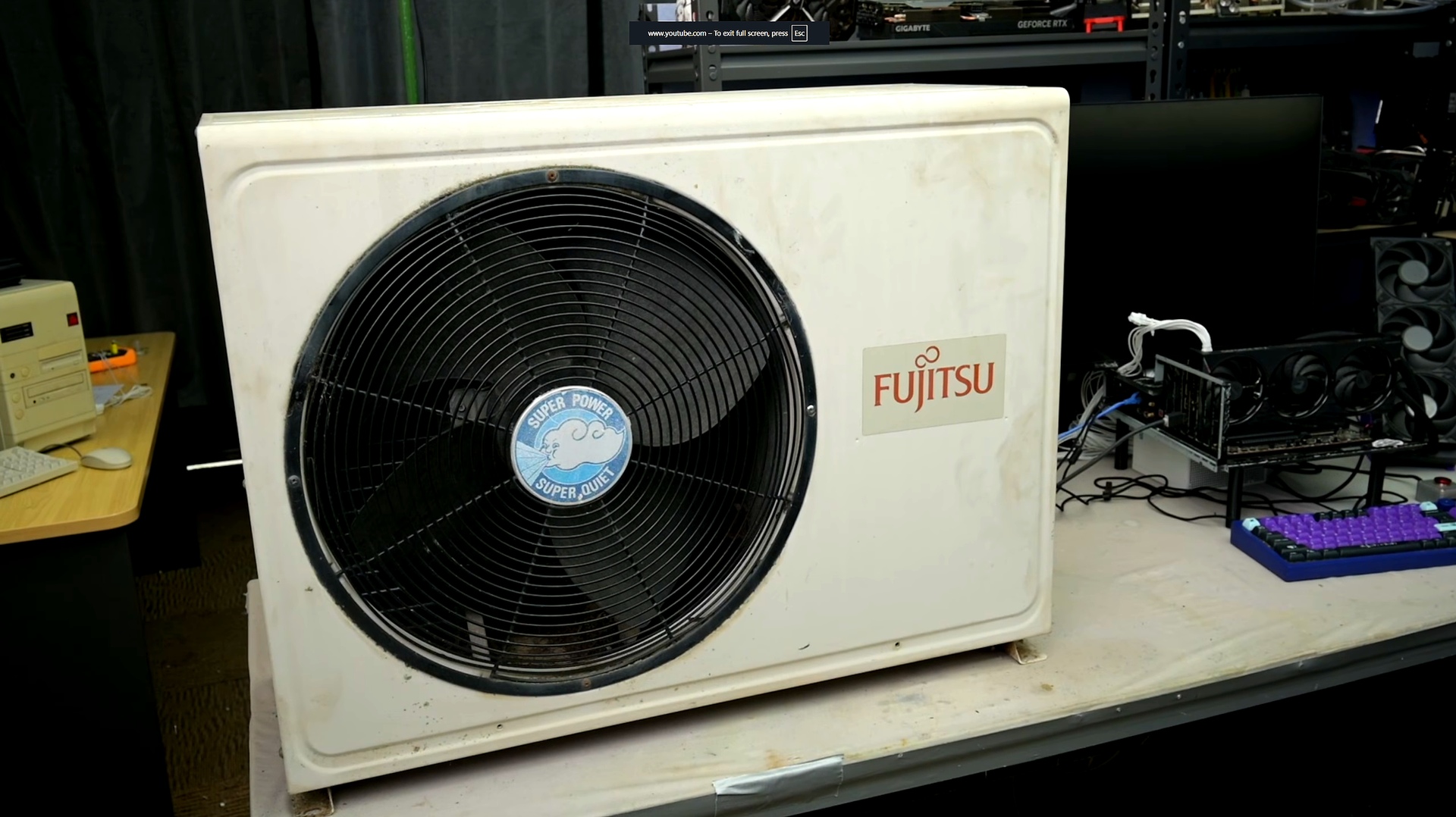 Modder uses a trash 4-kW air conditioner radiator for his test bench to see how well it can cool a PC